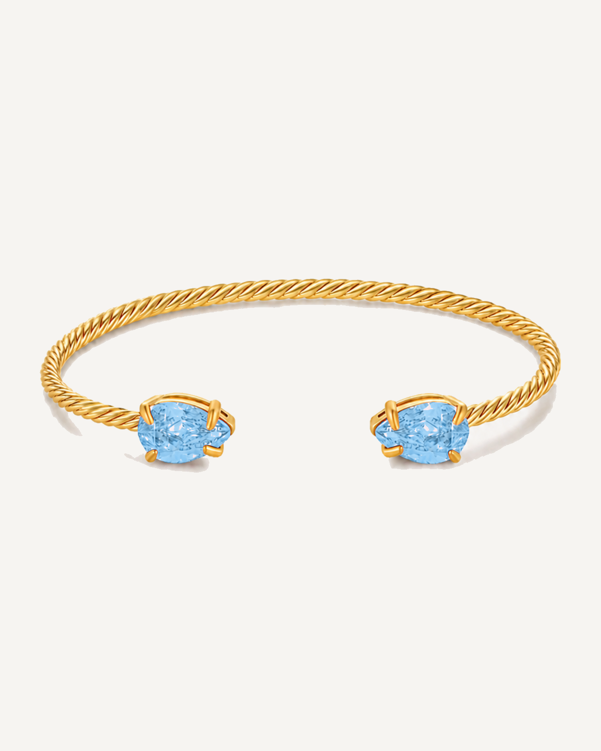 Gold Gem Twist Bracelet with blue stones, front view