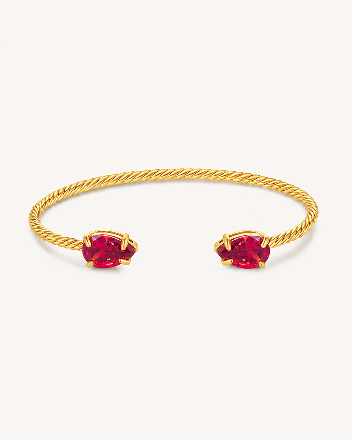 Gold Gem Twist Bracelet with red stones, front view