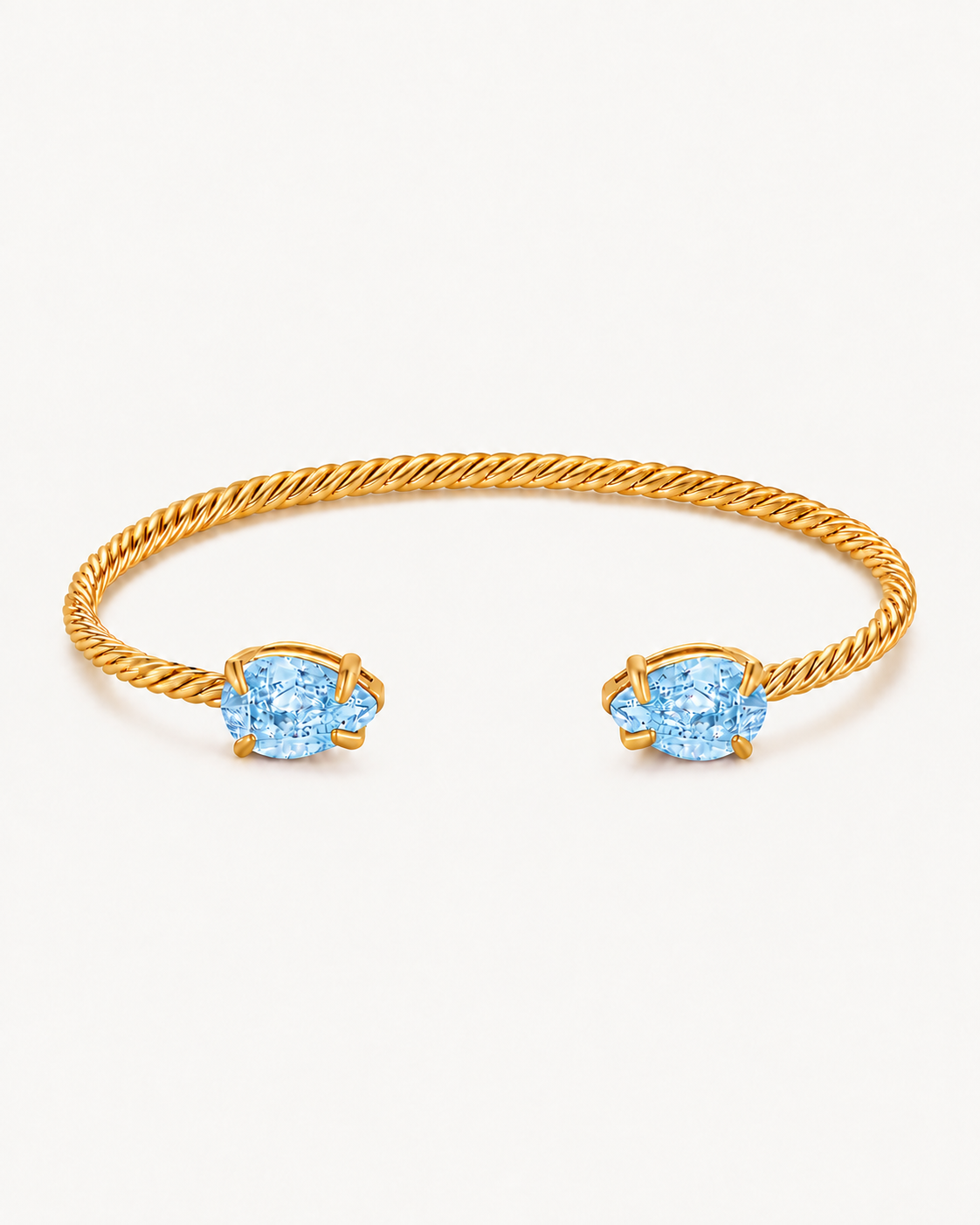 Gold Gem Twist Bracelet with blue stones, front view